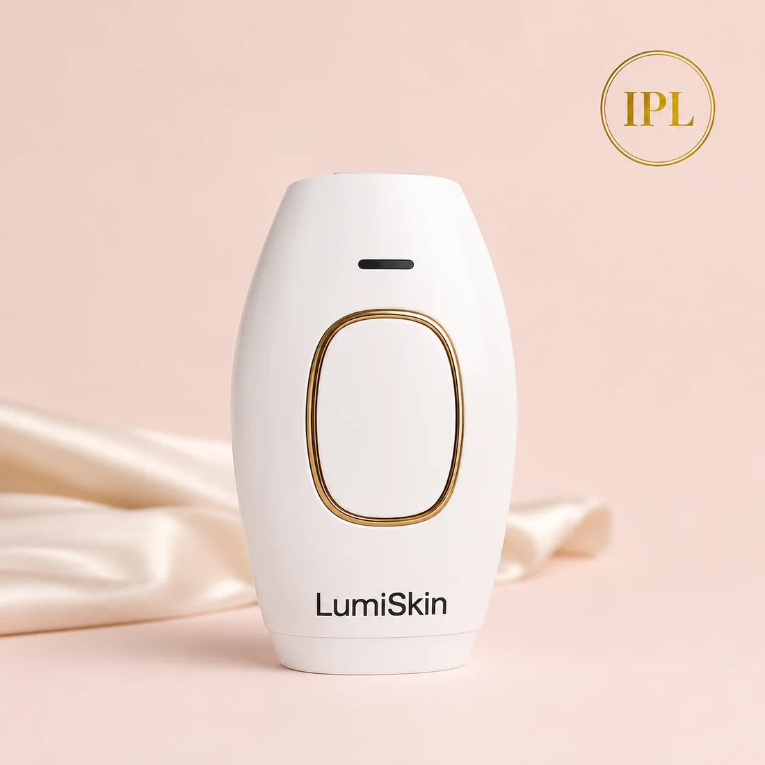 Depiladora IPL LumiSkin blanca con detalle dorado sobre fondo rosa y seda