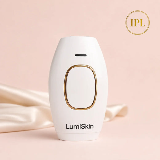 Depiladora IPL LumiSkin blanca con detalle dorado sobre fondo rosa y seda